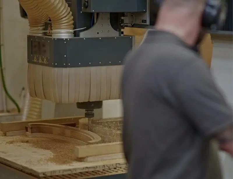CNC machine milling a frame