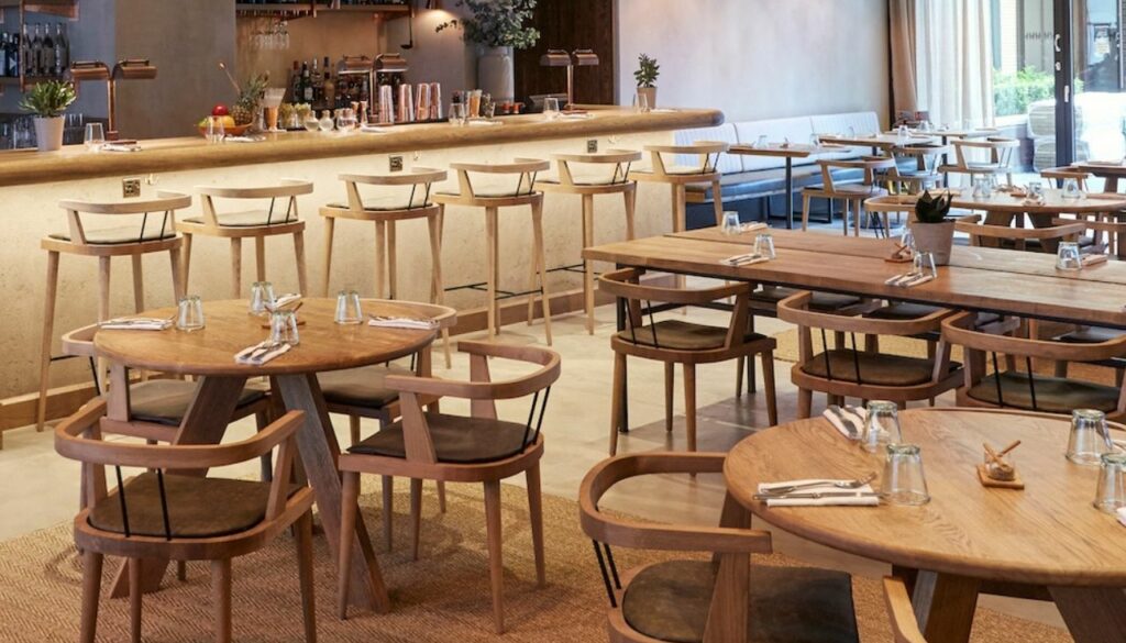 Custom wooden dining chairs and bar stools at Passo Restaurant, London