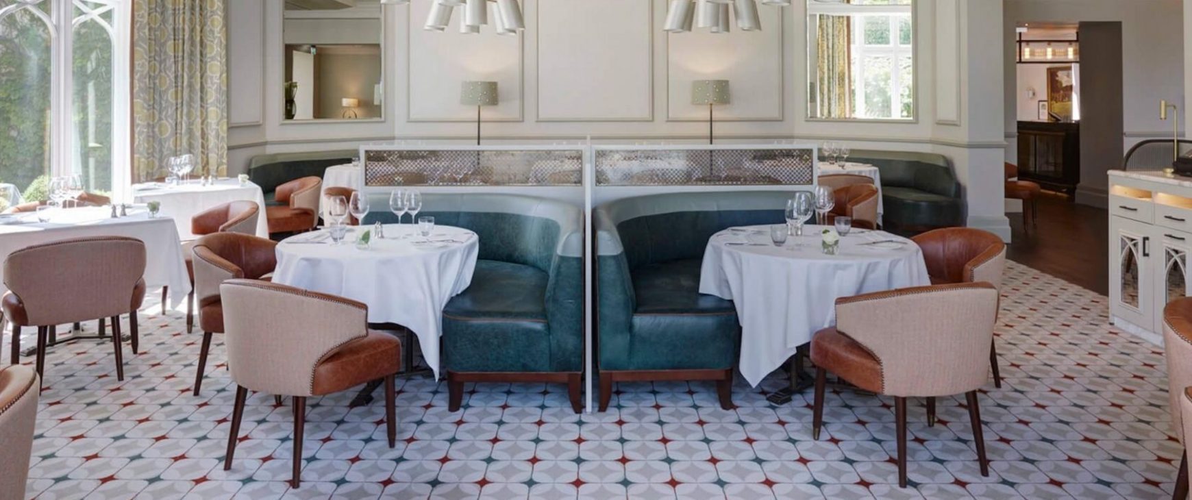 Bespoke dining chairs and teal banquette seating in Wentworth Gold Club