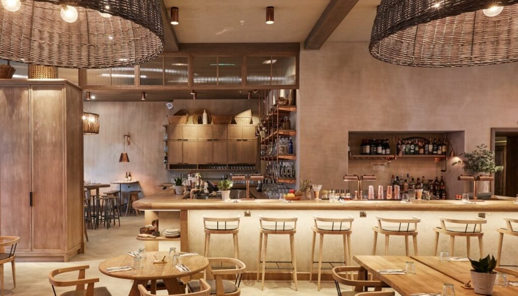 Bespoke restaurant chairs and bar seating beneath woven pendant lights at Passo, London