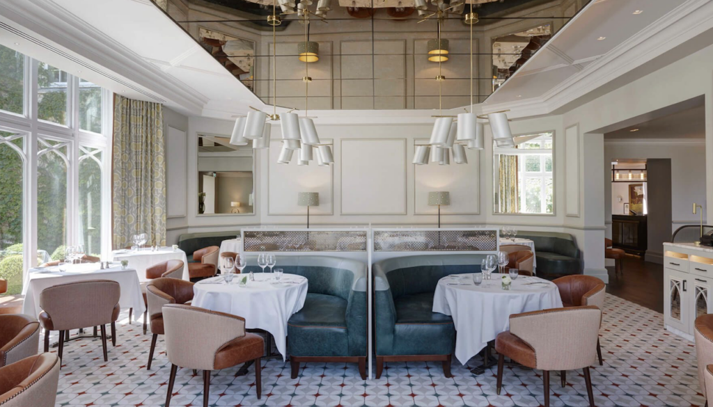 Upholstered banquettes and dining chairs at Wentworth Clubhouse, Surrey